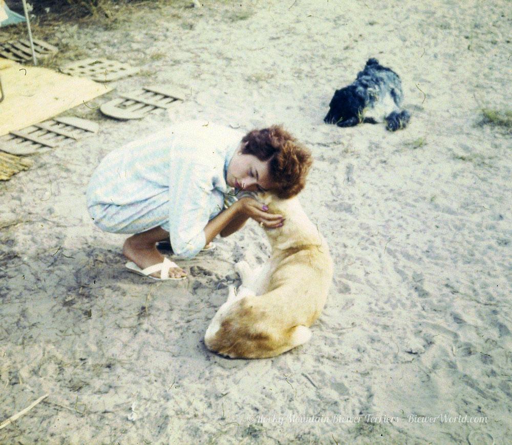 Gertrud Biewer hugging a stray dog at the campground